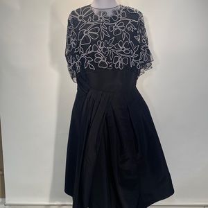 CAROLINA HERRERA
Embroidered Draped Capelet Dress